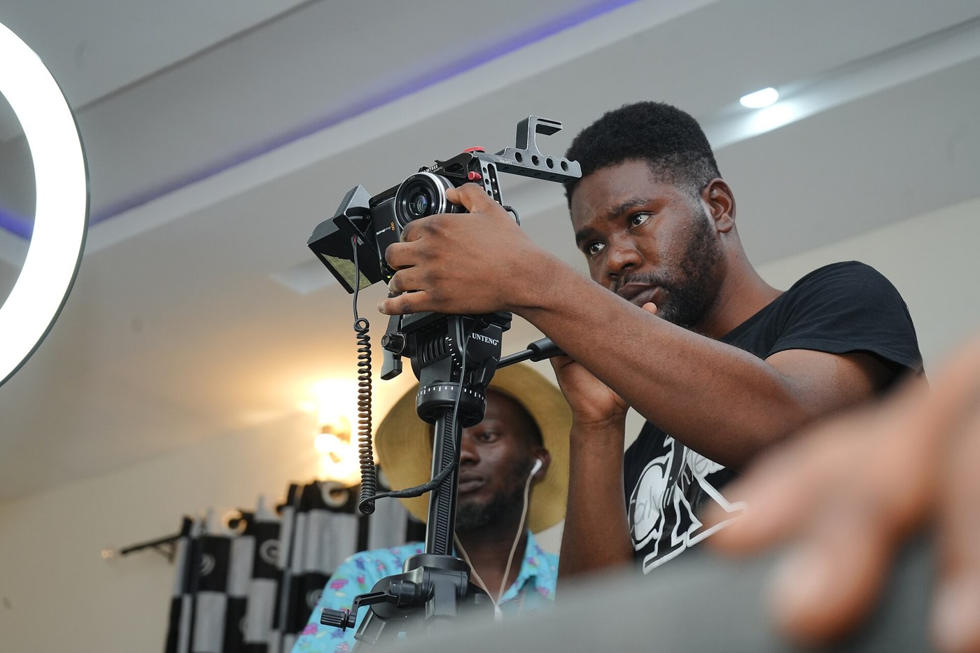 Person working with a camera; illustrative image